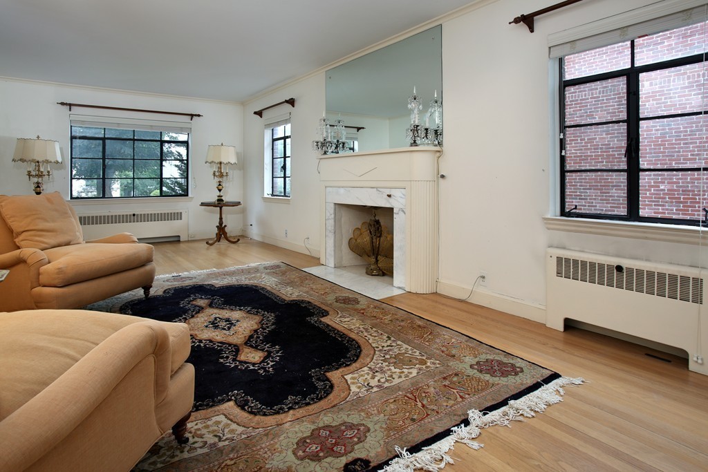 132 Bonad Road Brookline, MA 02467 - Photo 4 of 5 a living room with furniture and a fireplace