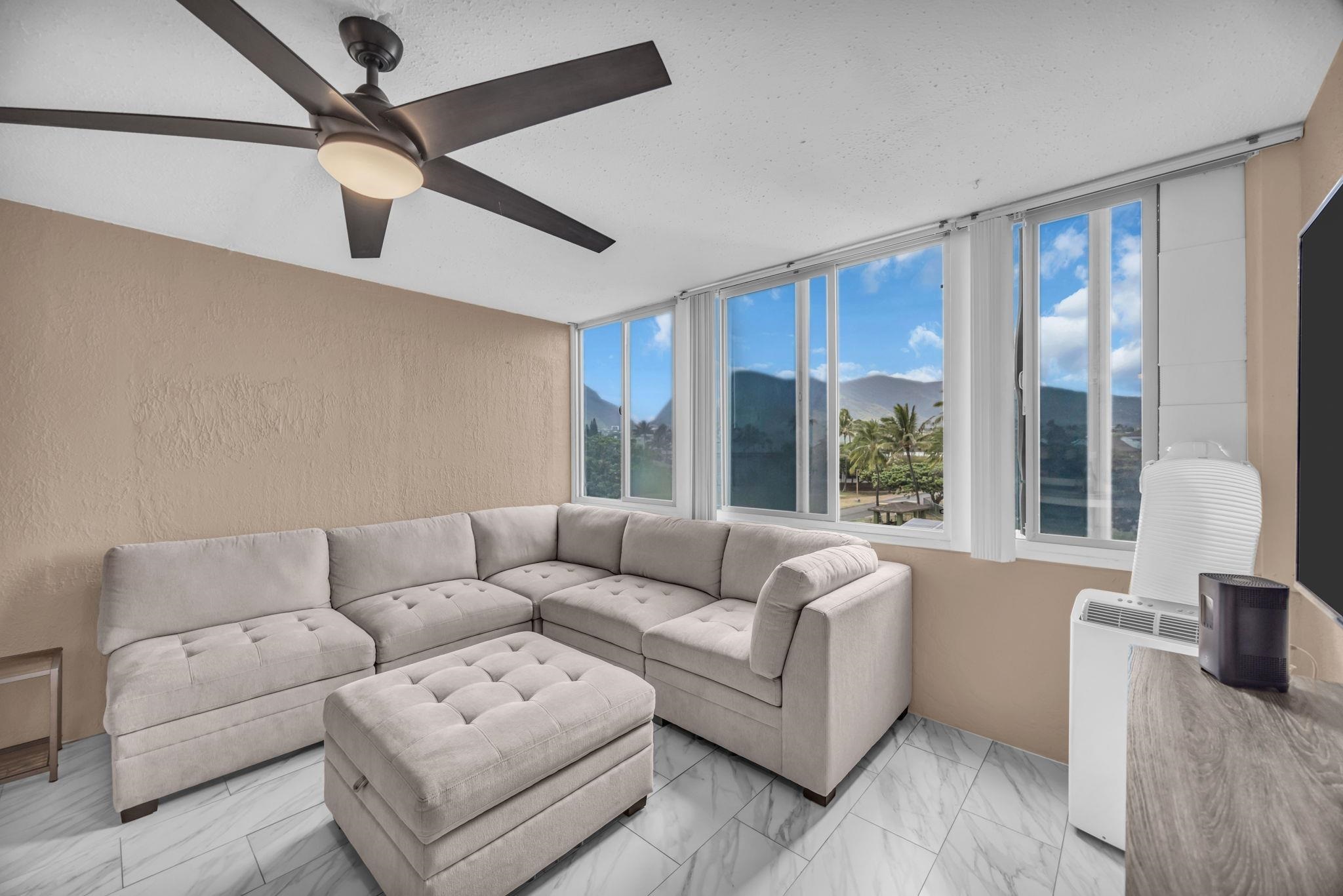 111 Kahului Beach Road, Unit D402 Kahului, HI 96732 - Photo 8 of 27 a living room with furniture and a large window