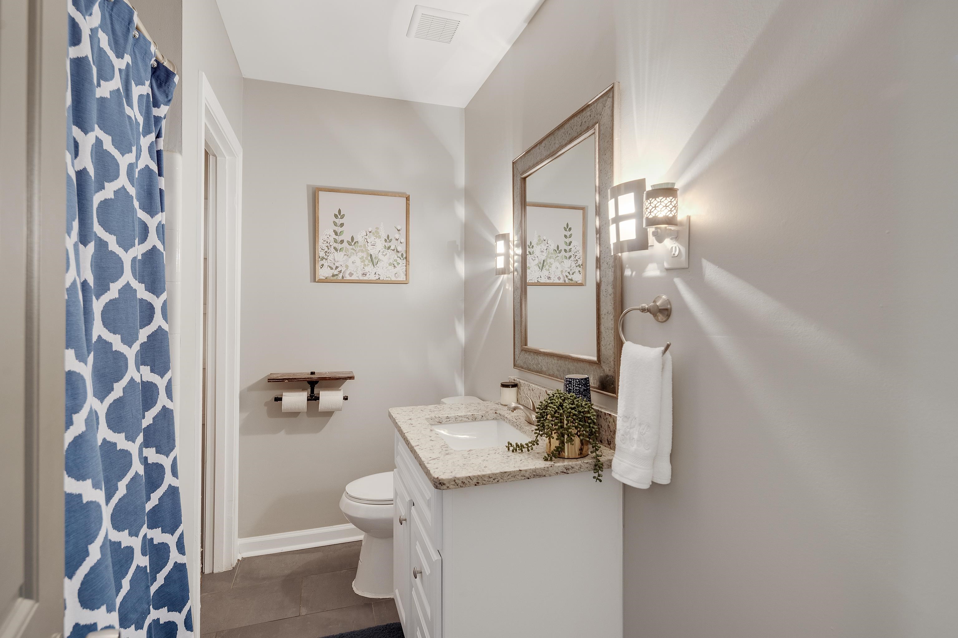 5271 Mason Road Memphis, TN 38120 - Photo 14 of 25 a bathroom with a sink and mirror with toilet