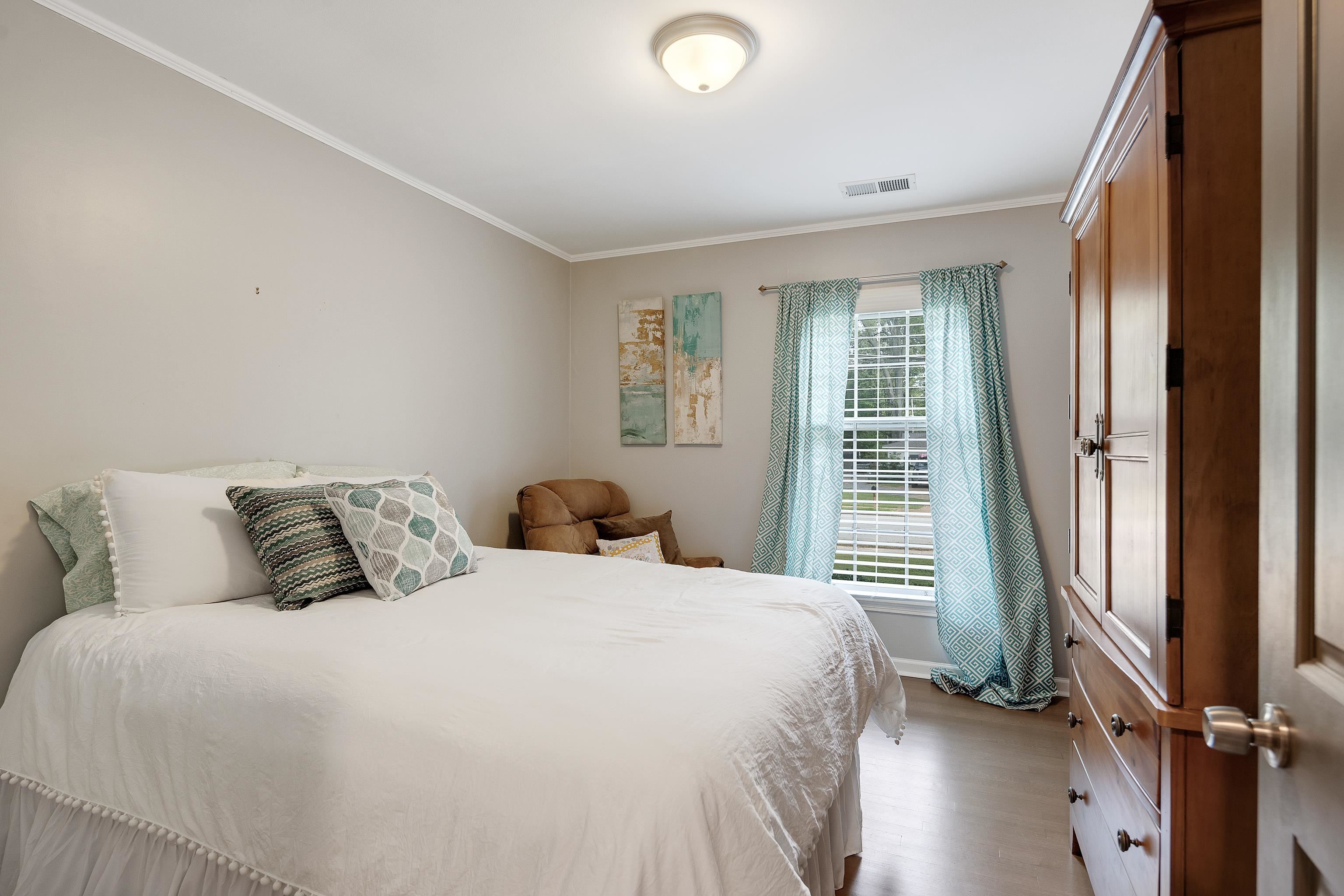 5271 Mason Road Memphis, TN 38120 - Photo 15 of 25 a bedroom with a bed and a large window
