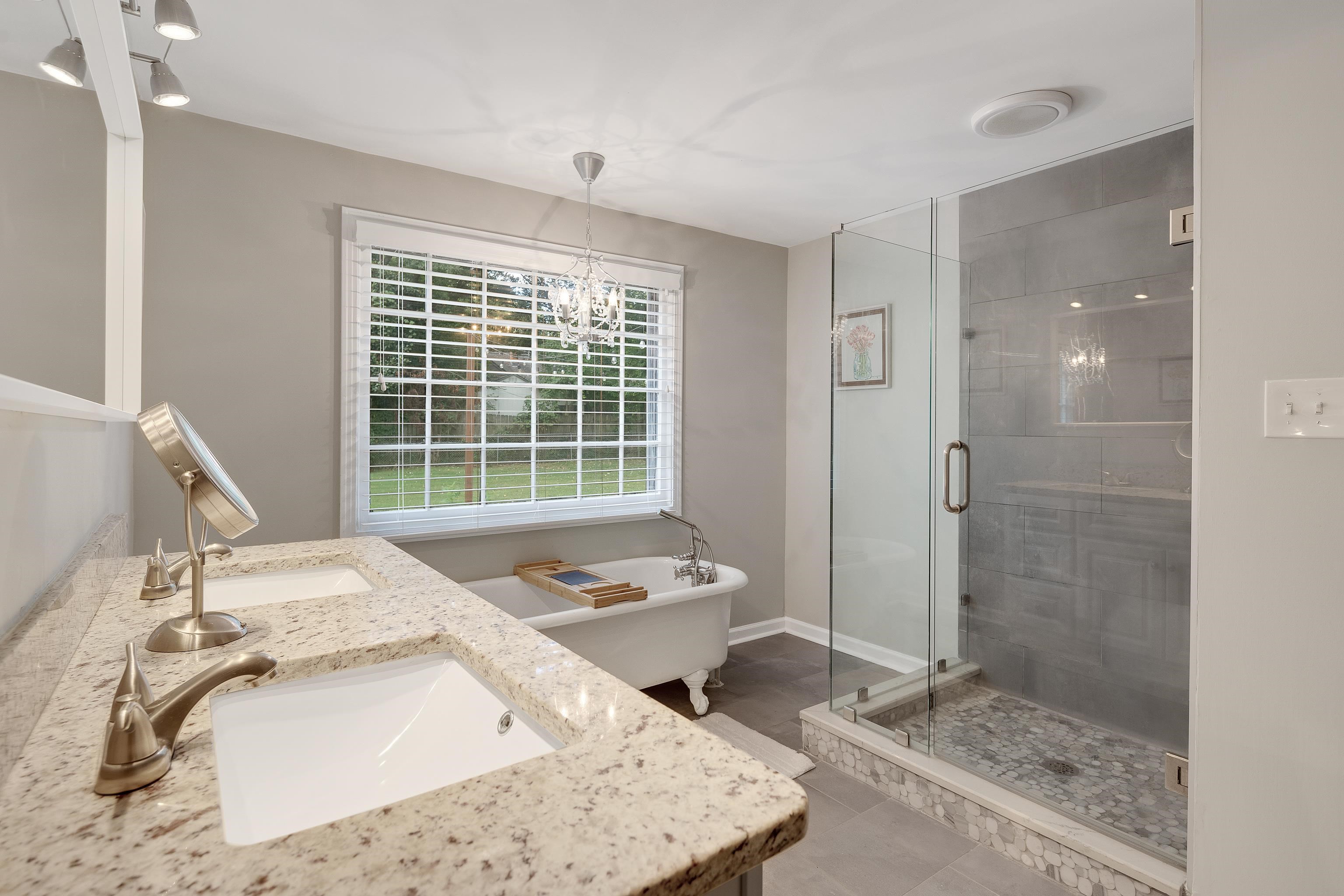 5271 Mason Road Memphis, TN 38120 - Photo 19 of 25 a bathroom with a granite countertop sink and a mirror