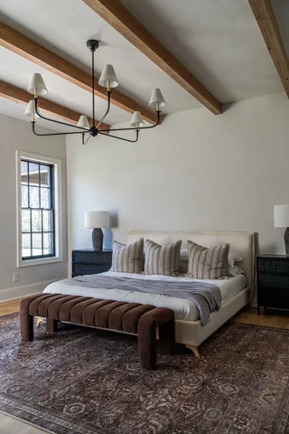 a living room with furniture and large windows