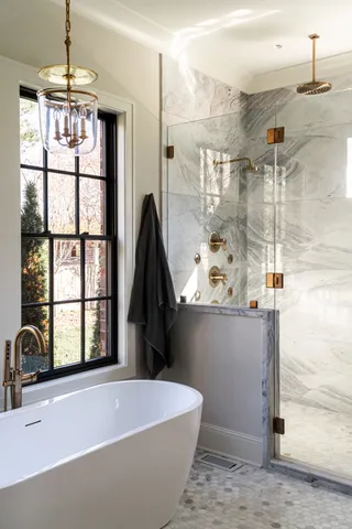 a bath tub sitting next to a window