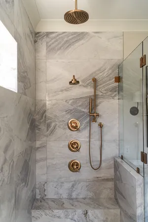 a bathroom with a bathtub and a shower