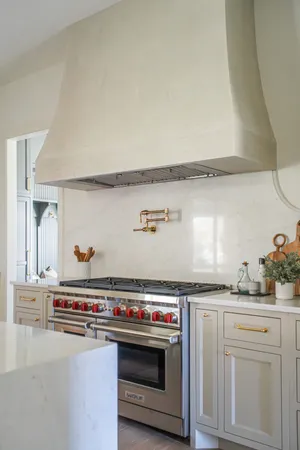 a utility room with stainless steel appliances and a sink