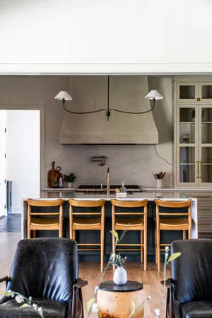 a kitchen with stainless steel appliances granite countertop a stove and a microwave