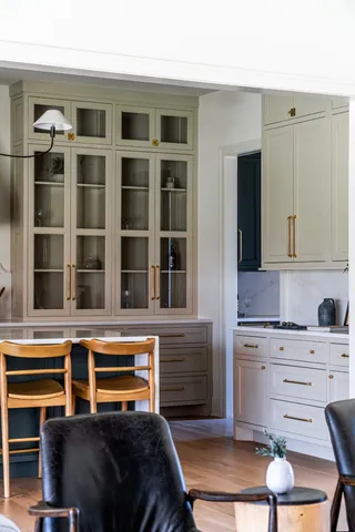 a bedroom with a bed and cabinets