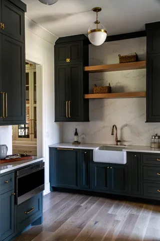 a kitchen with a sink and cabinets