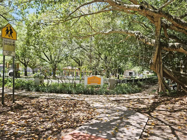 a front view of a house with a yard and a garage