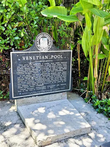 a view of a park with large trees