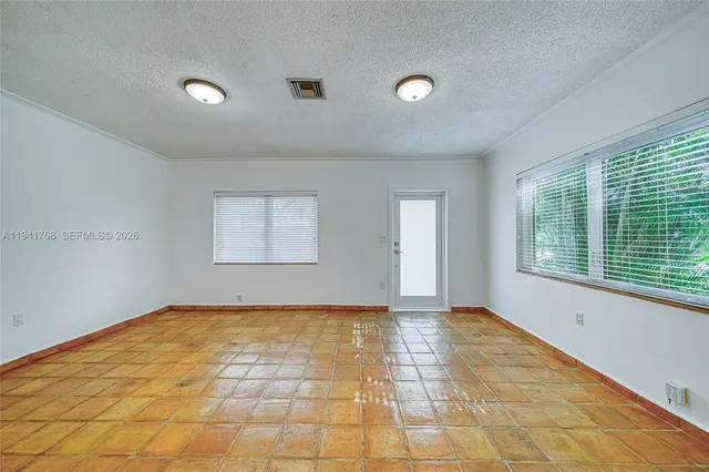 a view of an empty room and window