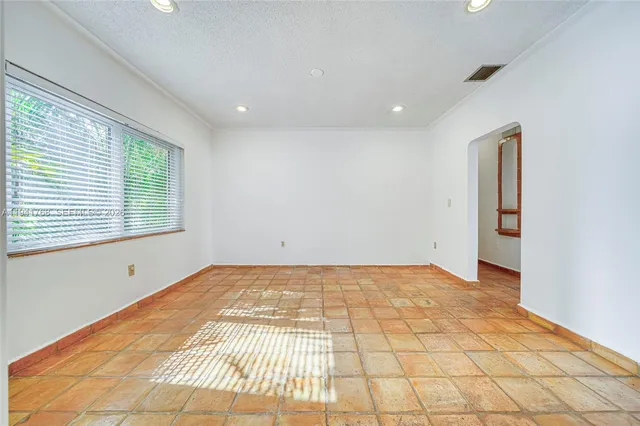a view of an empty room and window