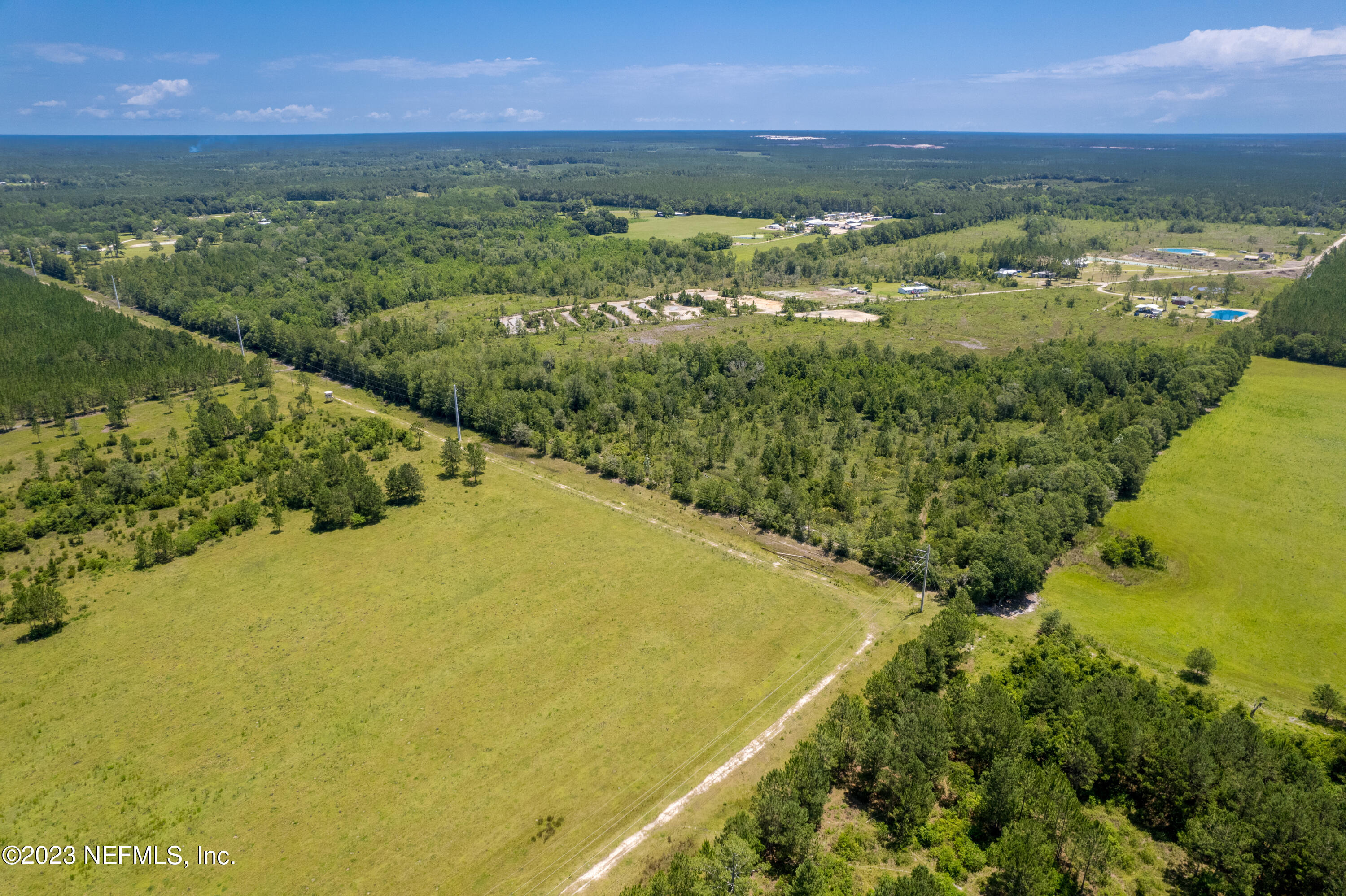 0 Southeast 113th Way Starke, FL 32091 - Photo 3 of 7 a view of a lake with a city