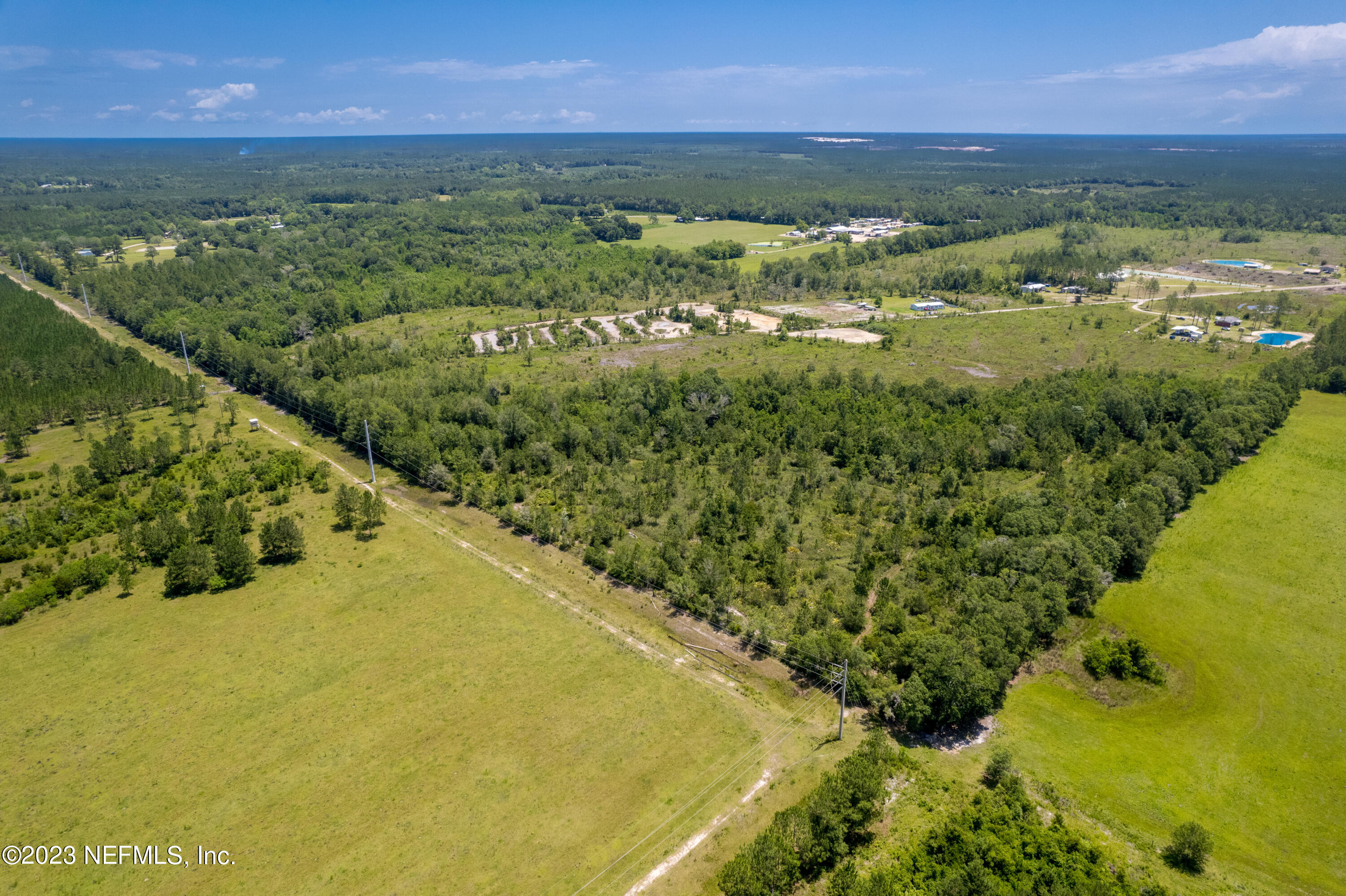 0 Southeast 113th Way Starke, FL 32091 - Photo 4 of 7 a view of a lake with a city