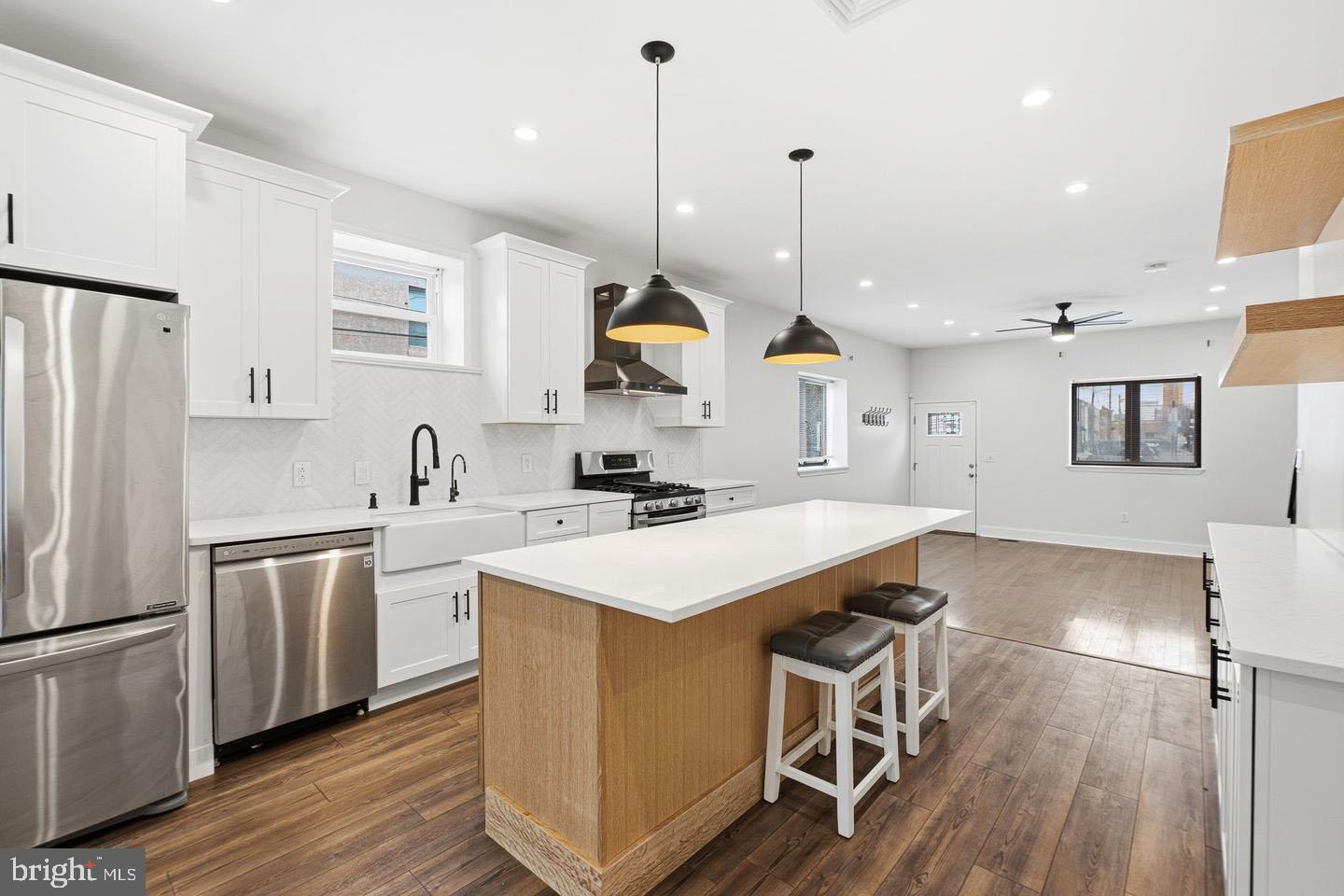 2106 Manton Street Philadelphia, PA 19146 - Photo 1 of 34 a kitchen with white cabinets and stainless steel appliances