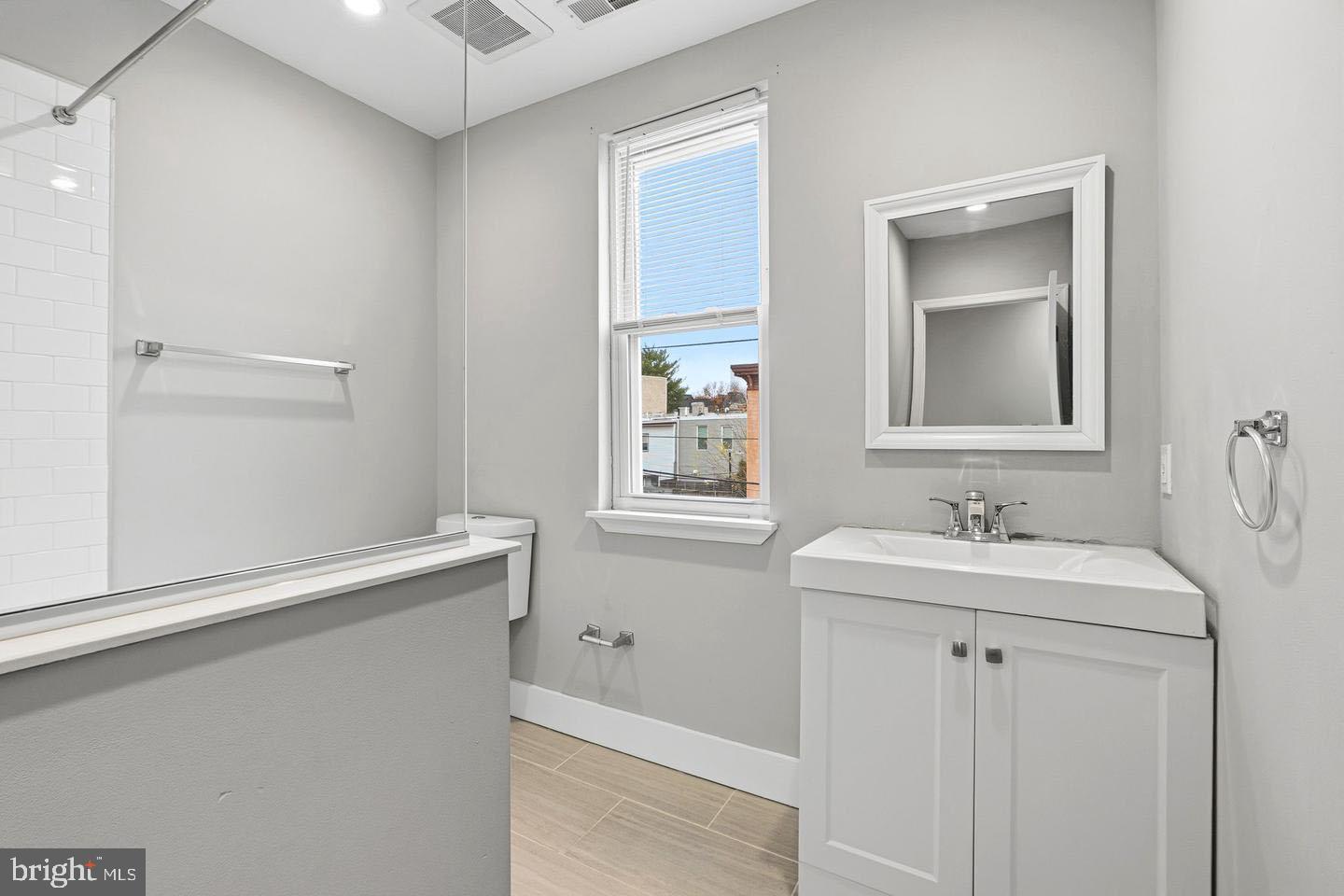 2106 Manton Street Philadelphia, PA 19146 - Photo 15 of 34 a bathroom with 2 sink and a mirror