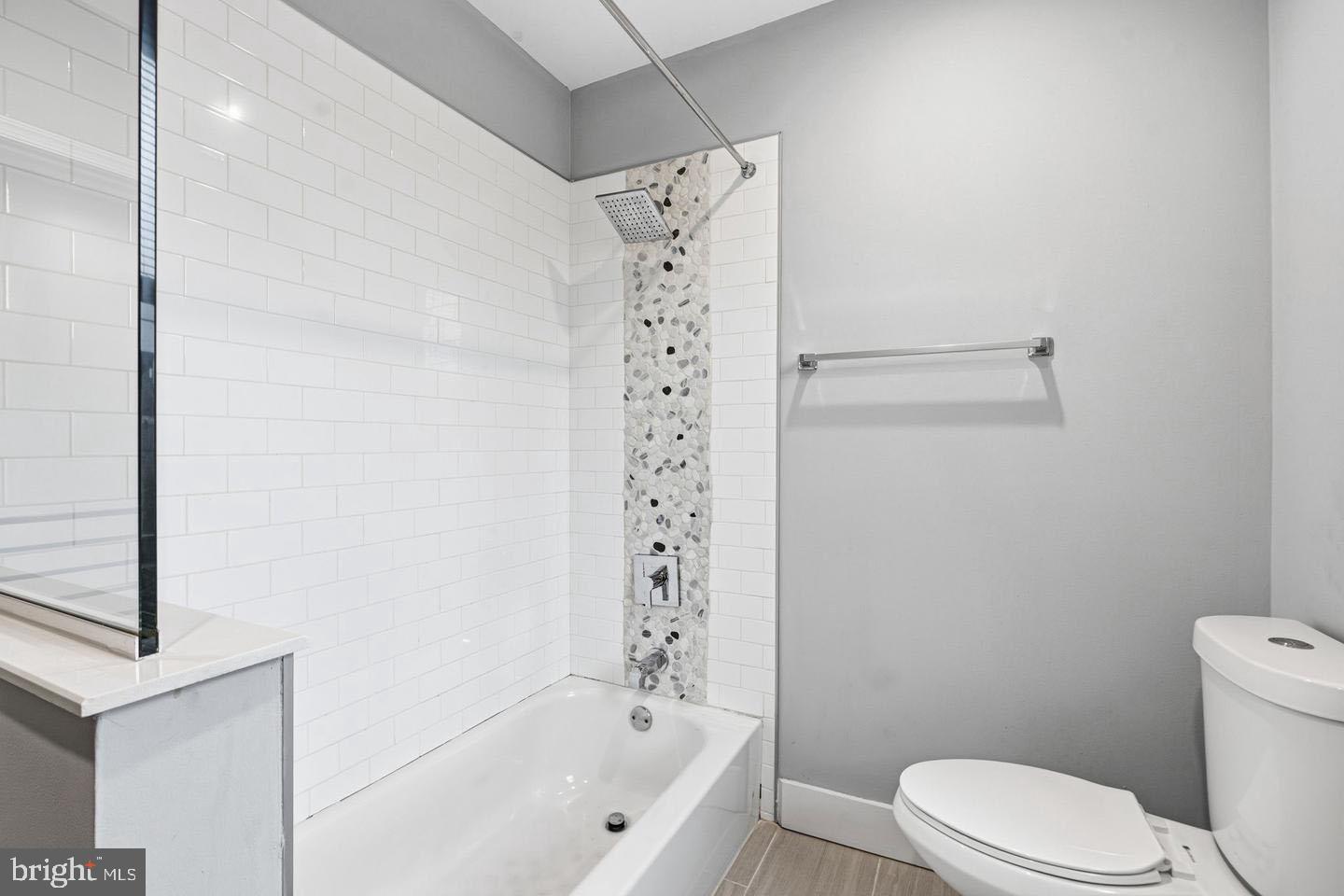 2106 Manton Street Philadelphia, PA 19146 - Photo 16 of 34 a bathroom with a shower a toilet and a bathtub