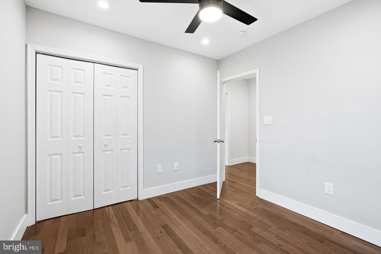 2106 Manton Street Philadelphia, PA 19146 - Photo 19 of 34 an empty room with wooden floor and windows