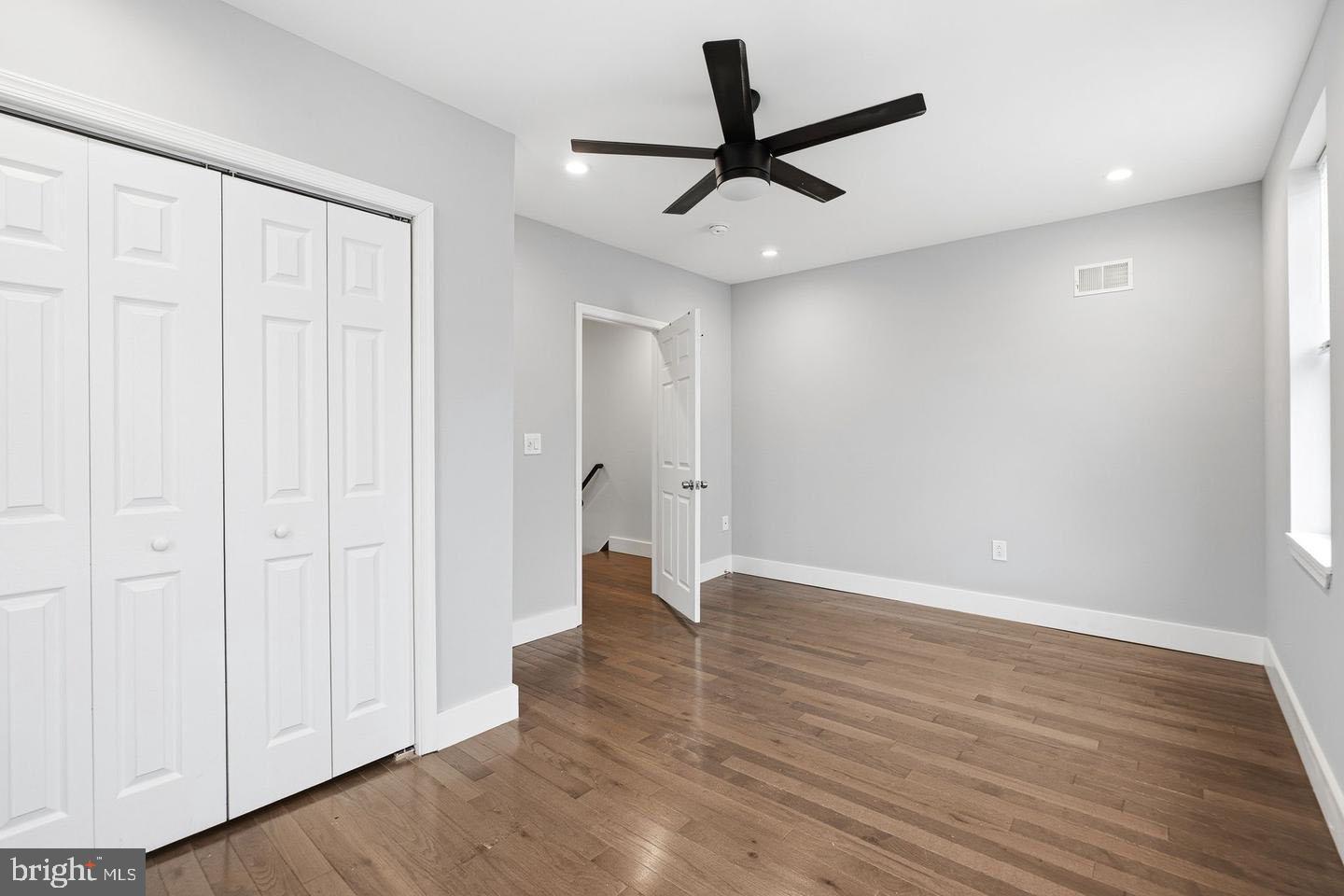 2106 Manton Street Philadelphia, PA 19146 - Photo 25 of 34 wooden floor in an empty room with a ceiling fan