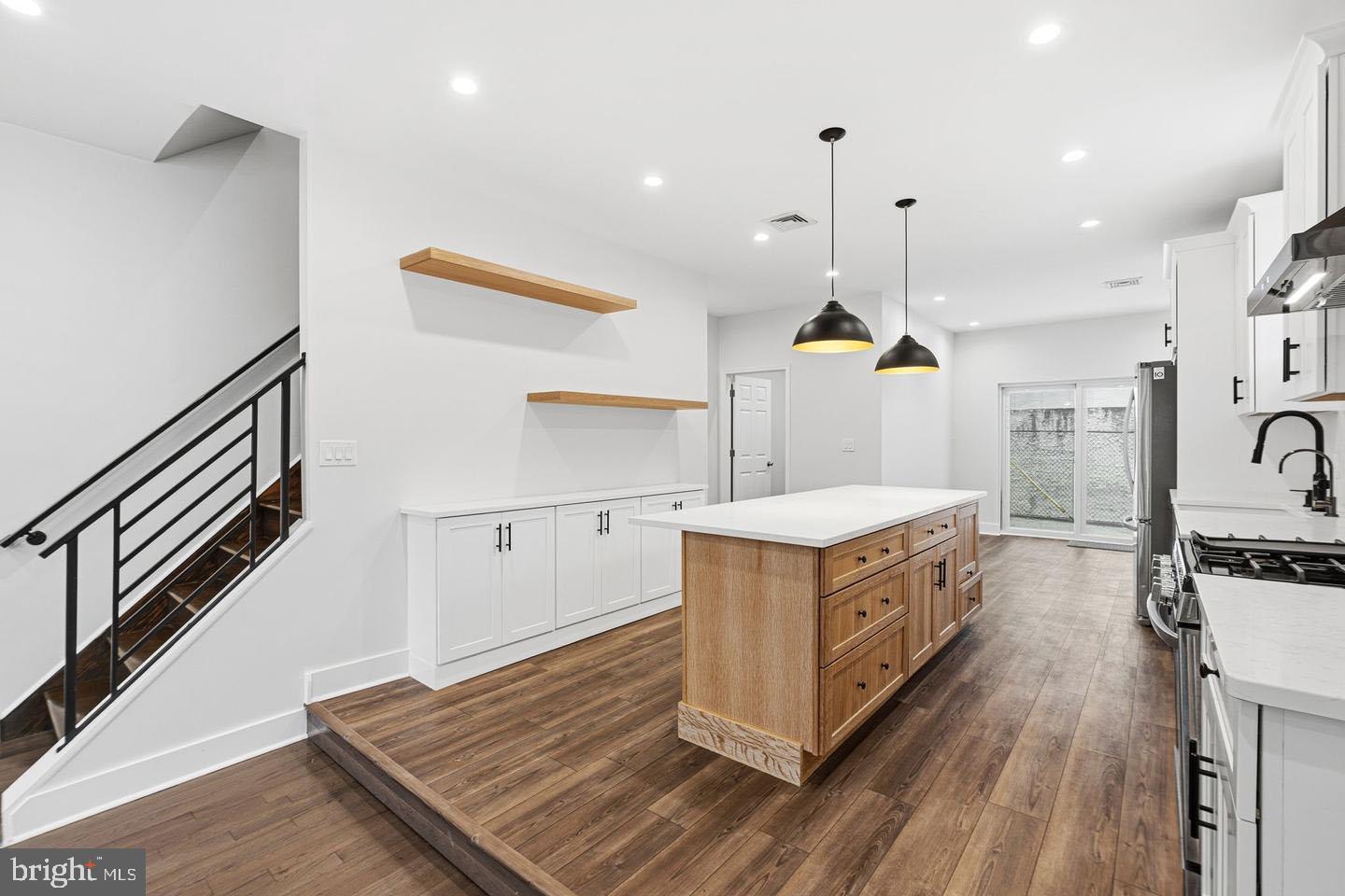 2106 Manton Street Philadelphia, PA 19146 - Photo 3 of 34 a kitchen with stainless steel appliances granite countertop a stove and a sink
