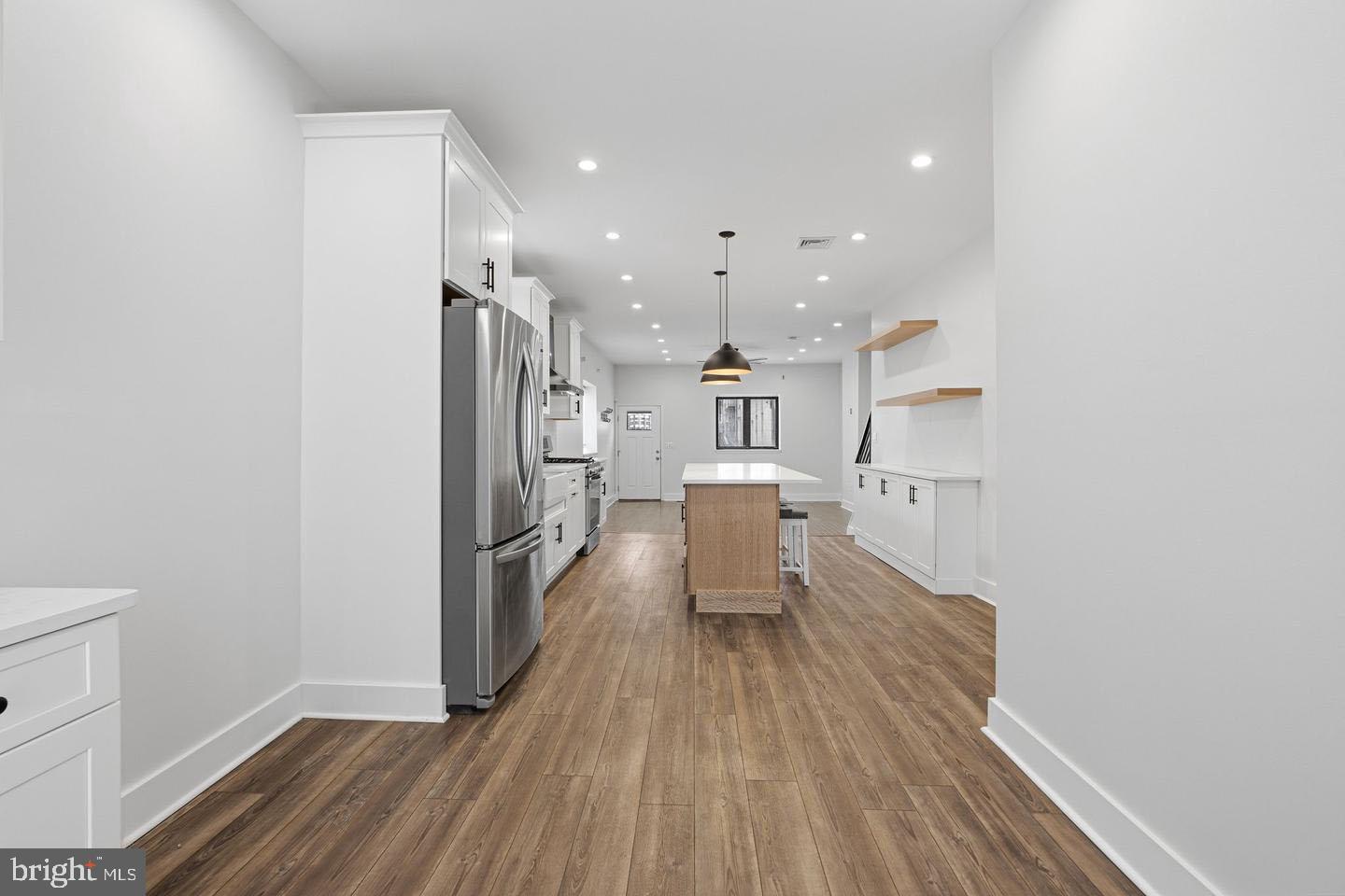 2106 Manton Street Philadelphia, PA 19146 - Photo 6 of 34 a kitchen with stainless steel appliances a refrigerator and a stove top oven
