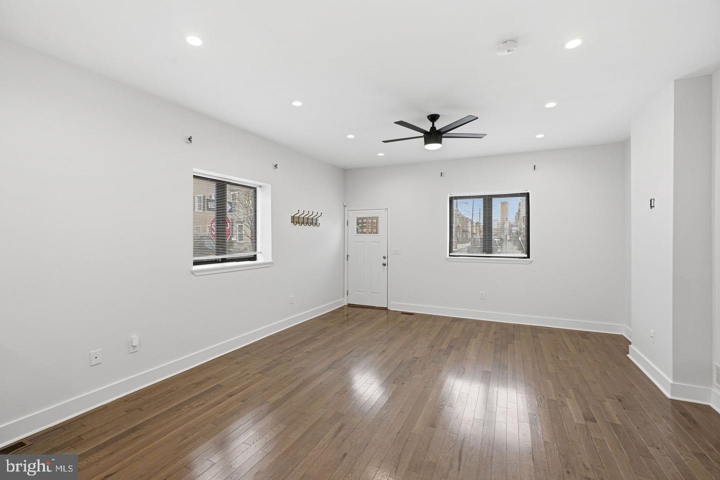 2106 Manton Street Philadelphia, PA 19146 - Photo 9 of 34 an empty room with wooden floor and windows