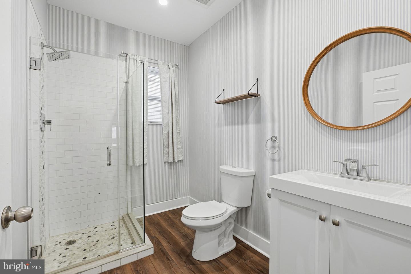 2106 Manton Street Philadelphia, PA 19146 - Photo 10 of 34 a bathroom with a toilet a sink and a mirror