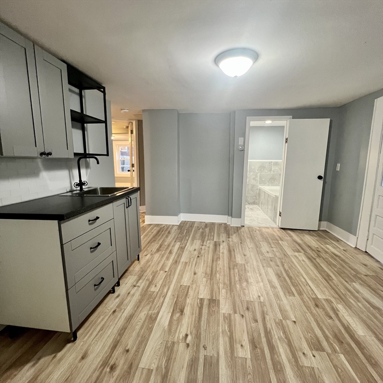 68 Springfield Street Chicopee, MA 01013 - Photo 13 of 41 a spacious bathroom with a sink and a mirror