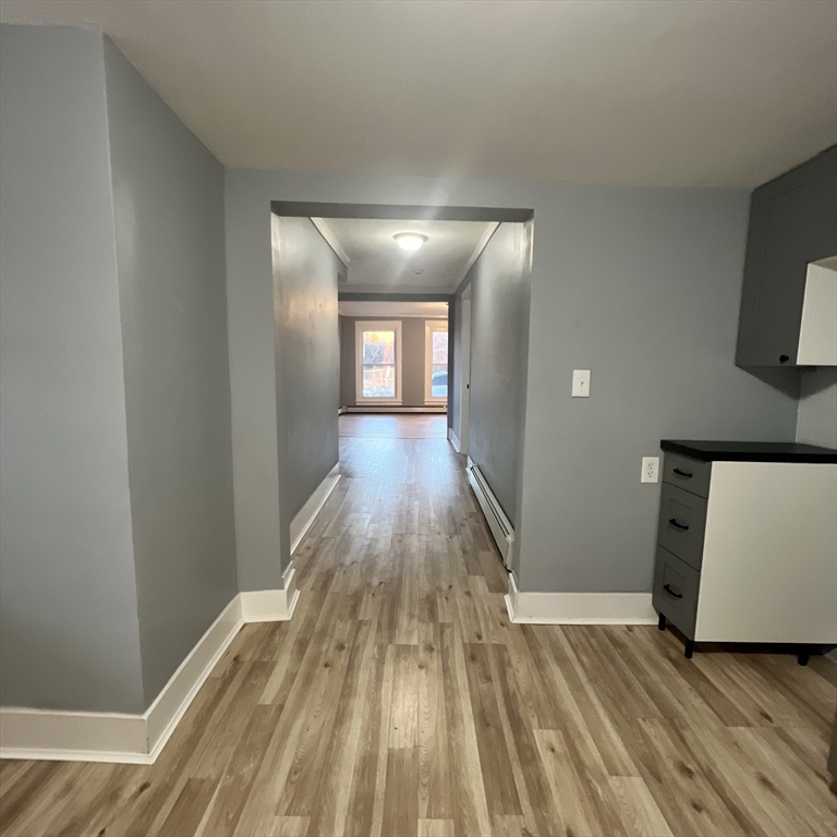 68 Springfield Street Chicopee, MA 01013 - Photo 16 of 41 a view of a room with wooden floor