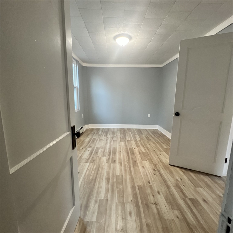 68 Springfield Street Chicopee, MA 01013 - Photo 17 of 41 a view of empty room with wooden floor