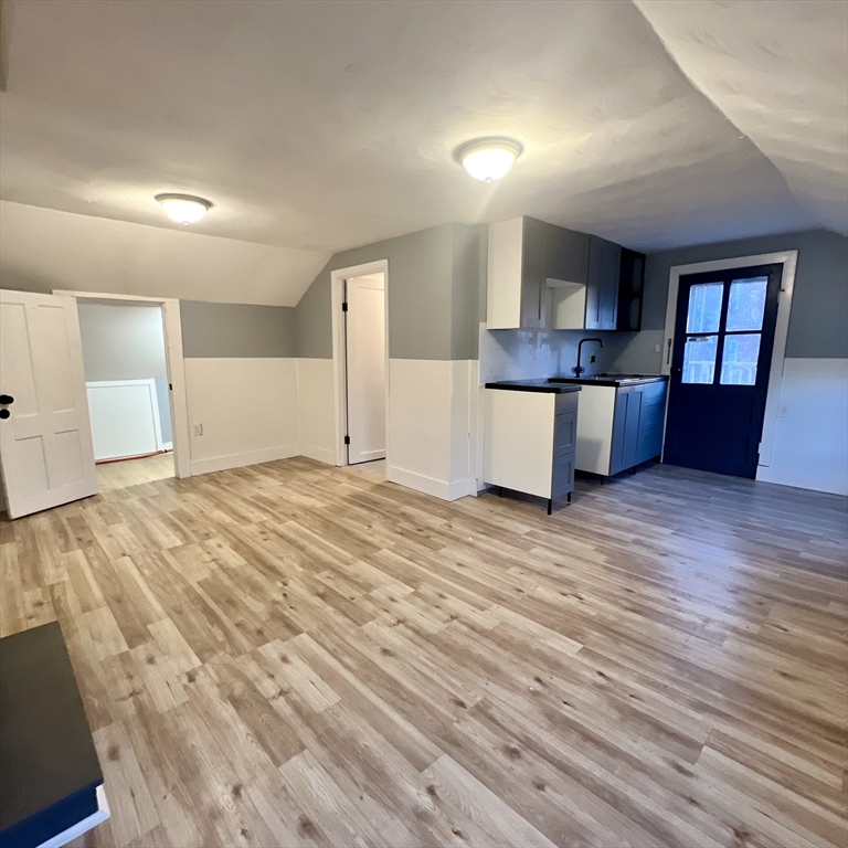 68 Springfield Street Chicopee, MA 01013 - Photo 25 of 41 a view of empty room with wooden floor and window