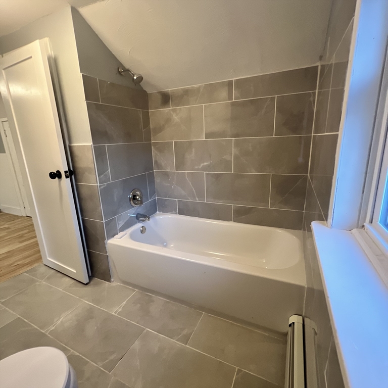 68 Springfield Street Chicopee, MA 01013 - Photo 30 of 41 a bathroom with a bathtub and a shower