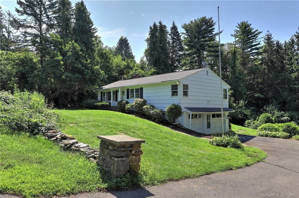 68 Mohegan Road Shelton, CT 06484 - Photo 1 of 1 a front view of house with a garden and patio