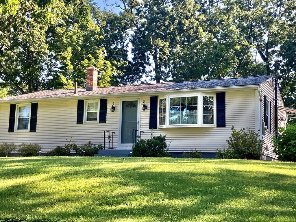 56 Ridge Road South Hadley, MA 01075 - Photo 1 of 37 a front view of a house with a garden