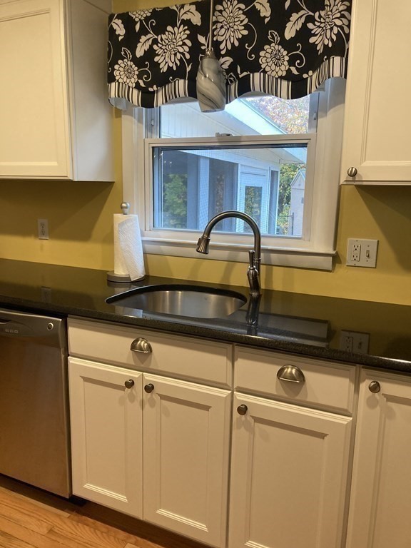 56 Ridge Road South Hadley, MA 01075 - Photo 11 of 37 a kitchen with a sink and cabinets