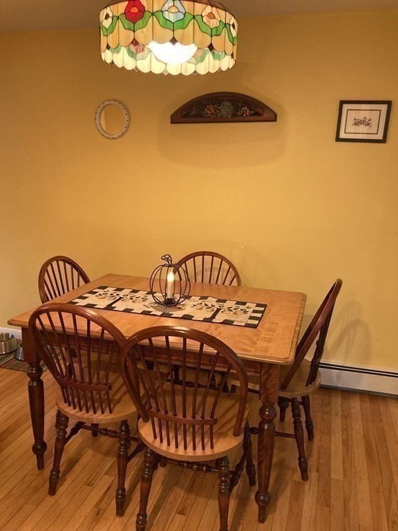 56 Ridge Road South Hadley, MA 01075 - Photo 12 of 37 a view of a dining room with furniture and chandelier