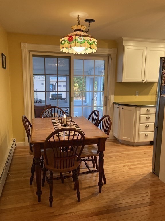 56 Ridge Road South Hadley, MA 01075 - Photo 15 of 37 a view of a dining room with furniture and chandelier