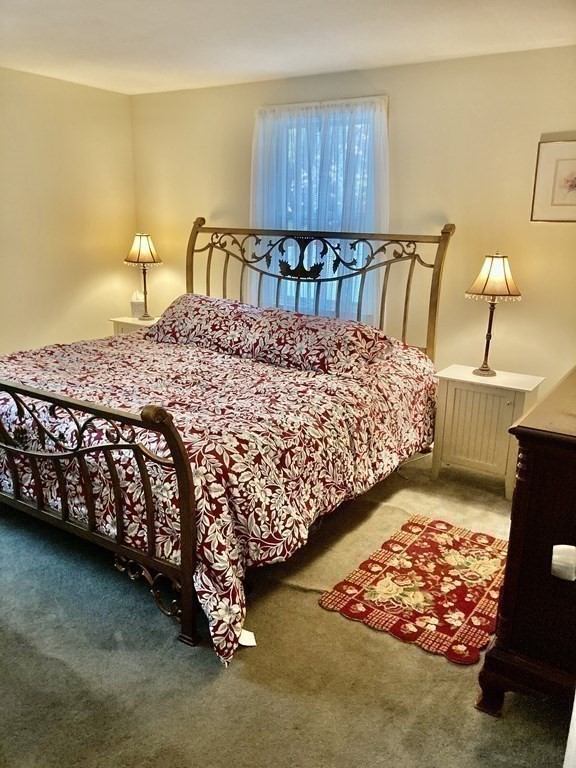 56 Ridge Road South Hadley, MA 01075 - Photo 21 of 37 a bed sitting in a bedroom next to a window