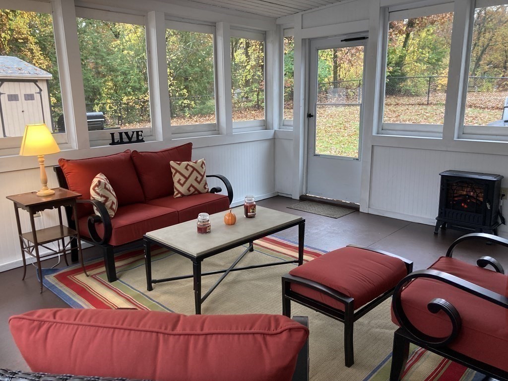 56 Ridge Road South Hadley, MA 01075 - Photo 26 of 37 a living room with furniture a flat screen tv and windows