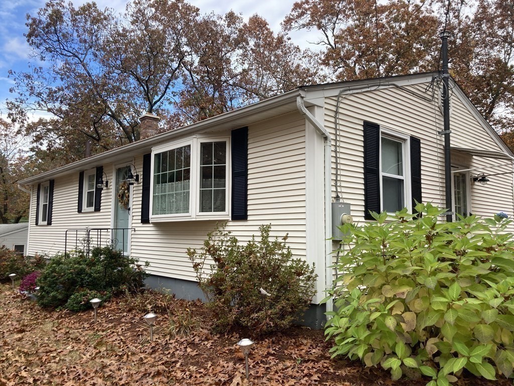 56 Ridge Road South Hadley, MA 01075 - Photo 3 of 37 a house that has a lot of flower plants