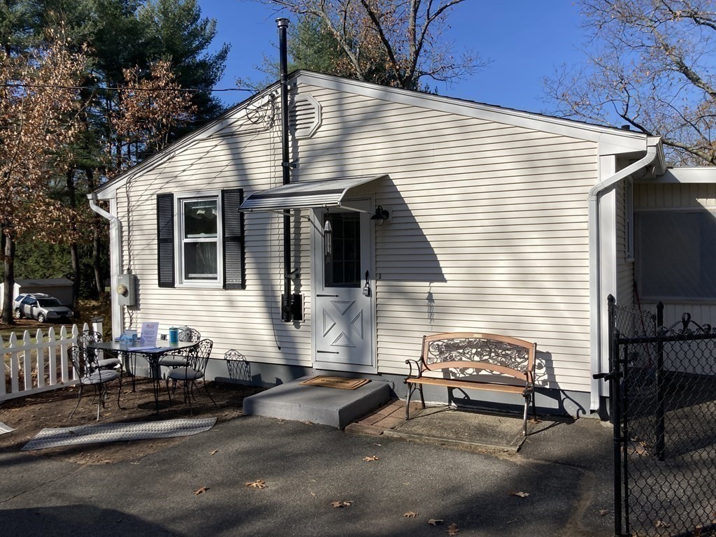 56 Ridge Road South Hadley, MA 01075 - Photo 8 of 37 a view of a two chairs in the back yard