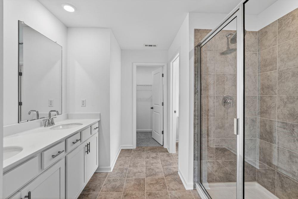 2831 Rosehall Way Lawrenceville, GA 30044 - Photo 20 of 53 a spacious bathroom with a shower and a sink