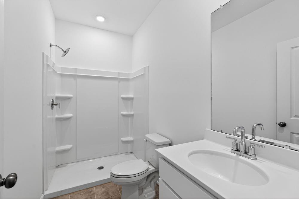 2831 Rosehall Way Lawrenceville, GA 30044 - Photo 30 of 53 a bathroom with a sink toilet and shower