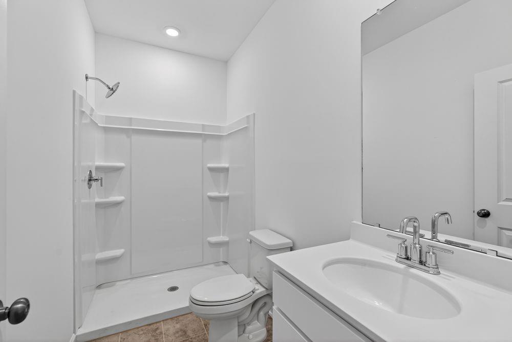 2831 Rosehall Way Lawrenceville, GA 30044 - Photo 32 of 53 a bathroom with a sink toilet and shower
