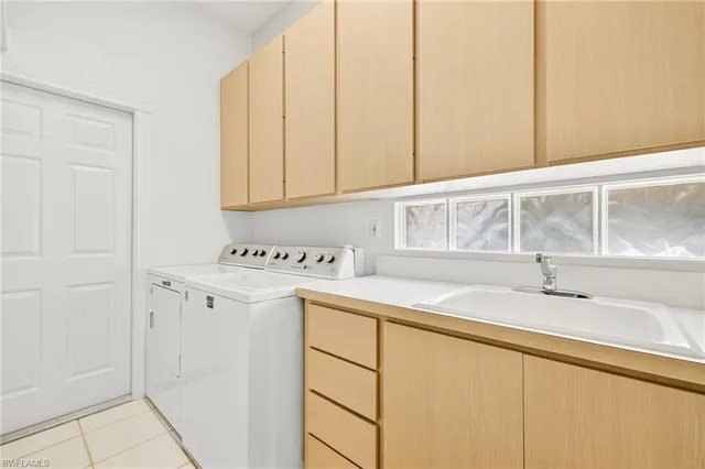 a bathroom with a sink and a window