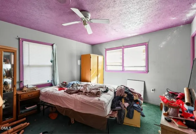 a kitchen with a refrigerator and a stove