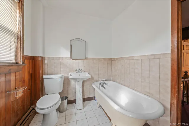 a bathroom with a toilet and a sink