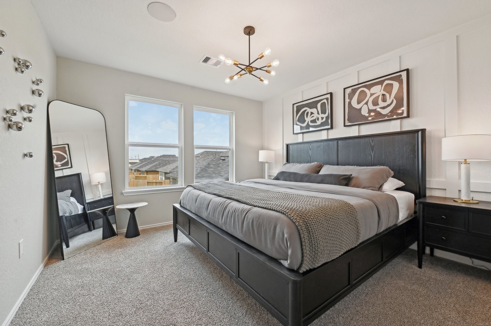 16911 Vinters Way Houston, TX 77090 - Photo 18 of 26 a bedroom with a bed painting on wall and a large window