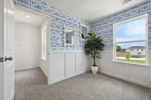 a view of entryway with window and wooden floor