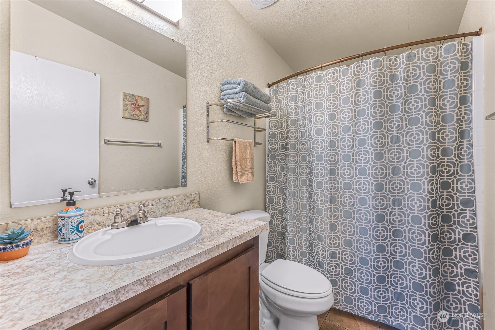 4524 Decatur Drive Ferndale, WA 98248 - Photo 26 of 30 a bathroom with a granite countertop sink toilet and a mirror